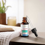 Close-up of dropper dispensing Kumkumadi Face Serum for pigmentation & dark spot treatment
